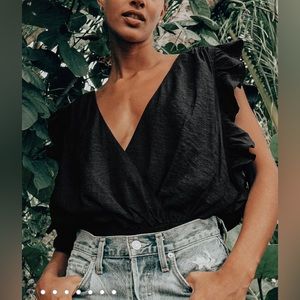 Smile Awhile Black Ruffled Surplice Bodysuit